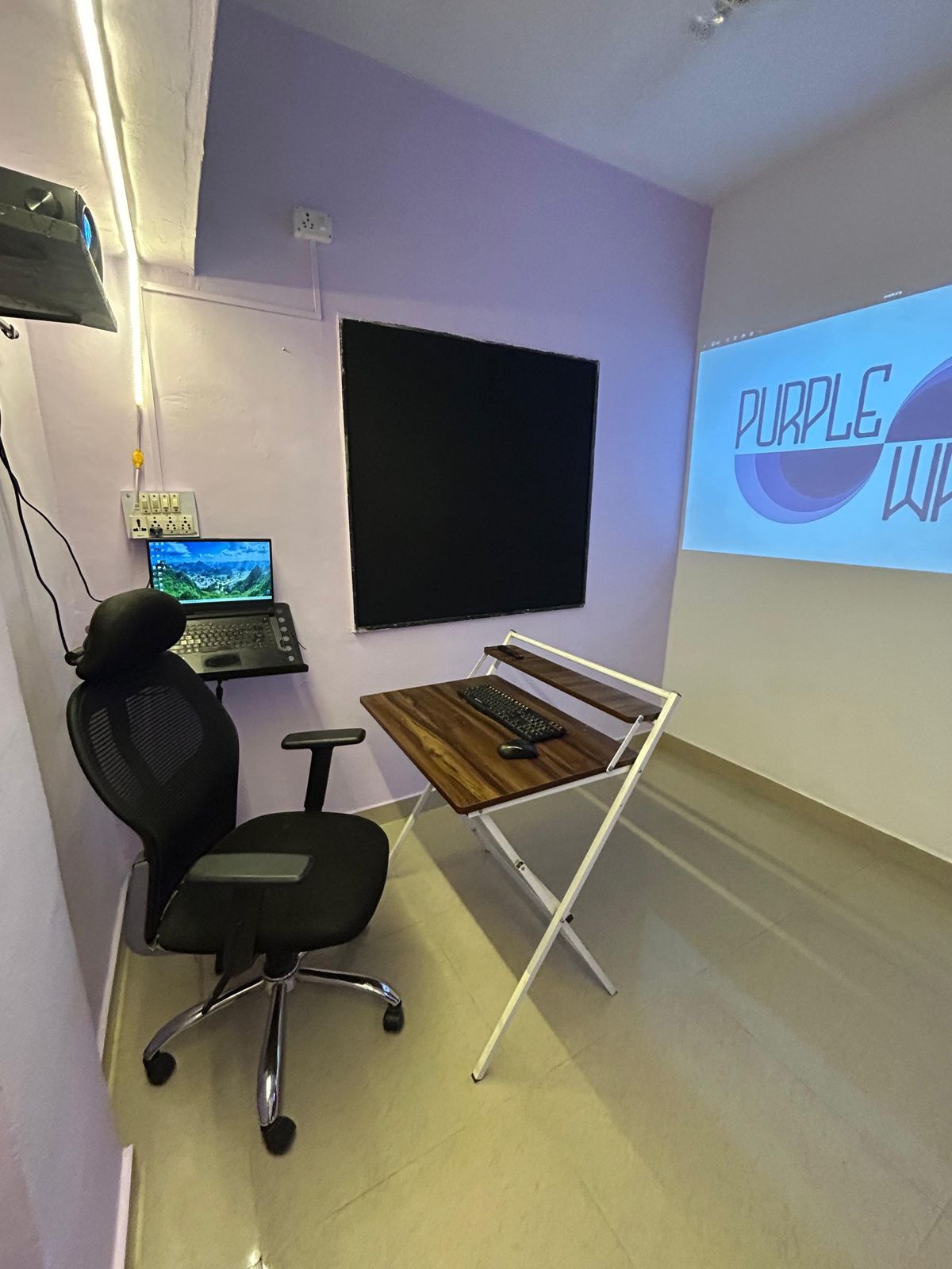 Second room with acoustic panel and projection